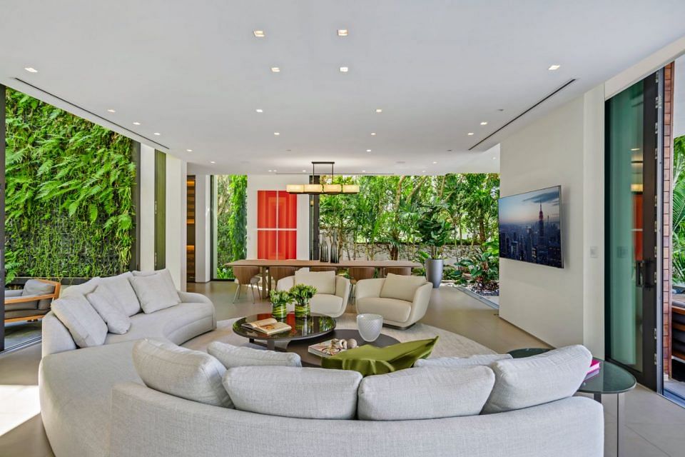 House Tour: Lil Wayne's Miami Beach Home is Worth US$29.5 Million. Living room with curved sofa