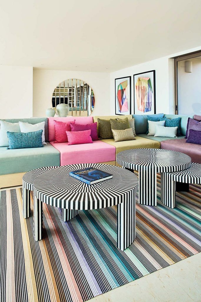 The homeowner designed the colourful sofa herself.