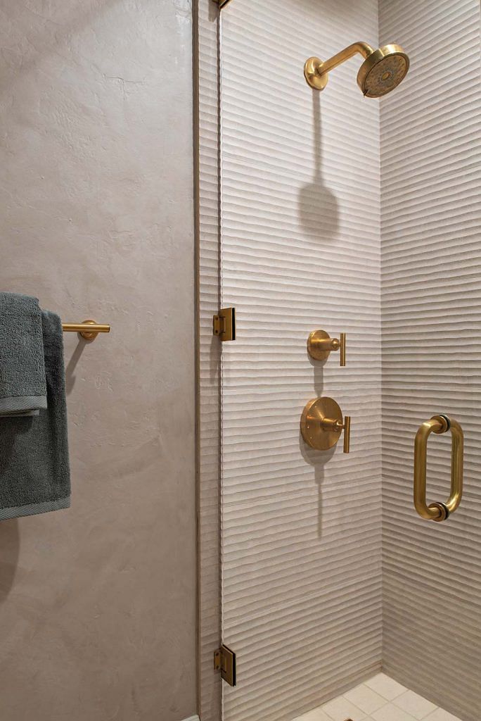 Matte gold fixtures provide a sense of laid-back luxe.