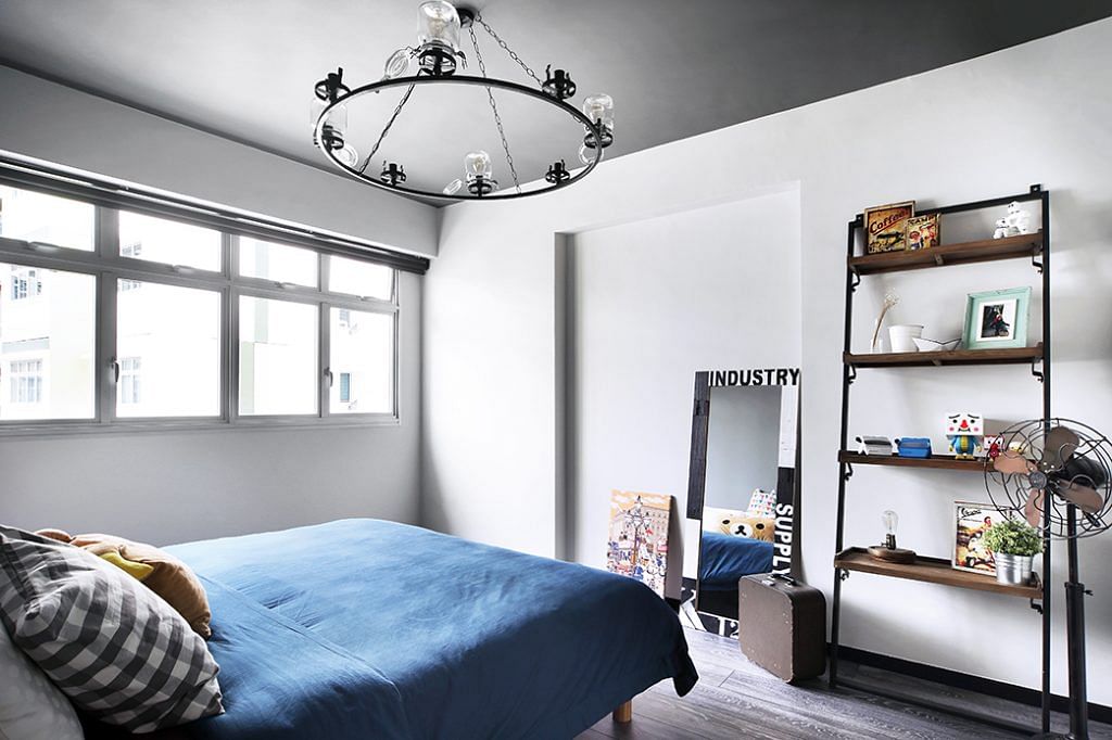 [Renovation cost: $45,000] The bedroom features a leaning shelf from Journey East, and a chandelier made out of mason jars by an artist in Thailand.