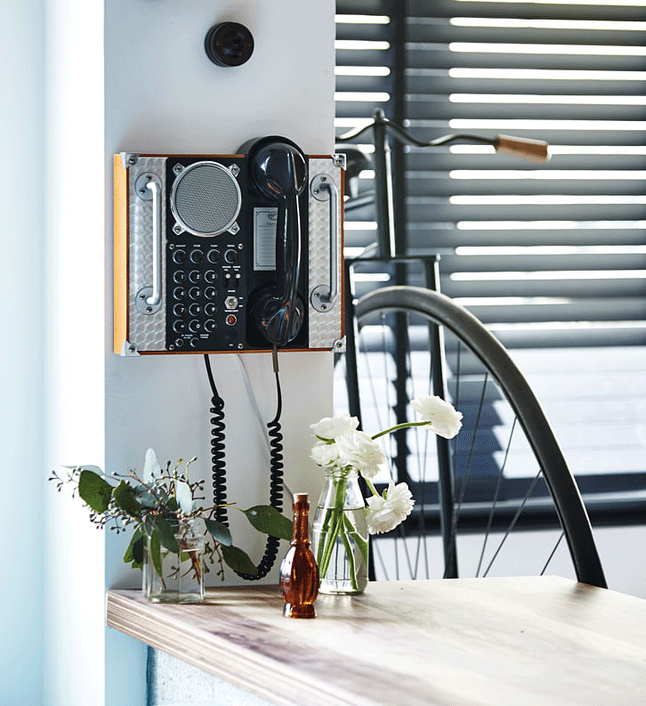 The aviation phone might appear to be a decorative prop, but it’s actually a functioning piece that goes perfectly with the decor of the home!