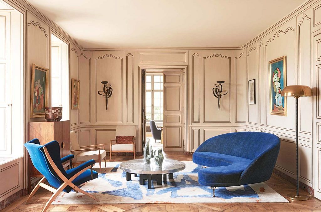 Sofa by Carlo de Carli (from antique dealer Florence Lopez); Franco Albini armchair.