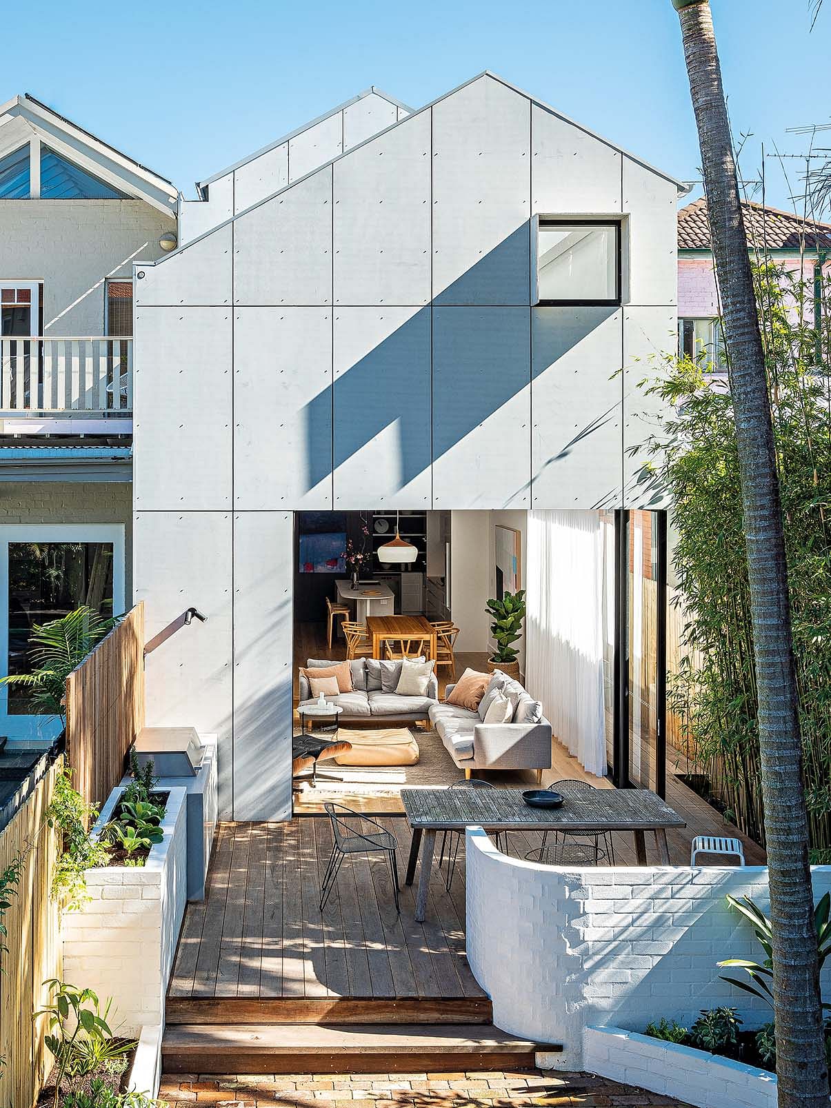 The backyard was designed by Pepo Botanic. The exterior is clad in James Hardie fibre cement boards.