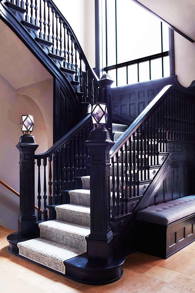 The main staircase in the home was preserved and updated with new banister caps.