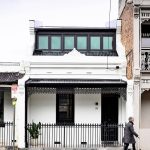 This shophouse-like house you see was designed by Australia-based Tom Robertson Architects. The black and white facade is just a sneek peek of the sleek colour palette found inside the home.