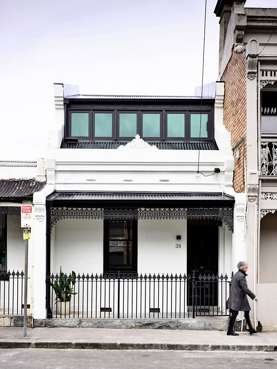 This shophouse-like house you see was designed by Australia-based Tom Robertson Architects. The black and white facade is just a sneek peek of the sleek colour palette found inside the home.