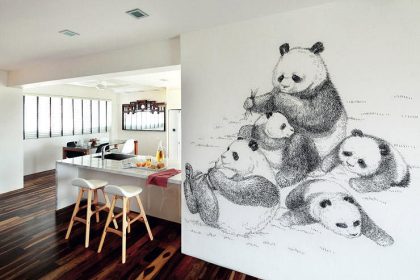 Interior design firm Mint Studio gave this HDB maisonette a clean and calm feel with its white palette and warm wood flooring and a wall mural of giant pandas.