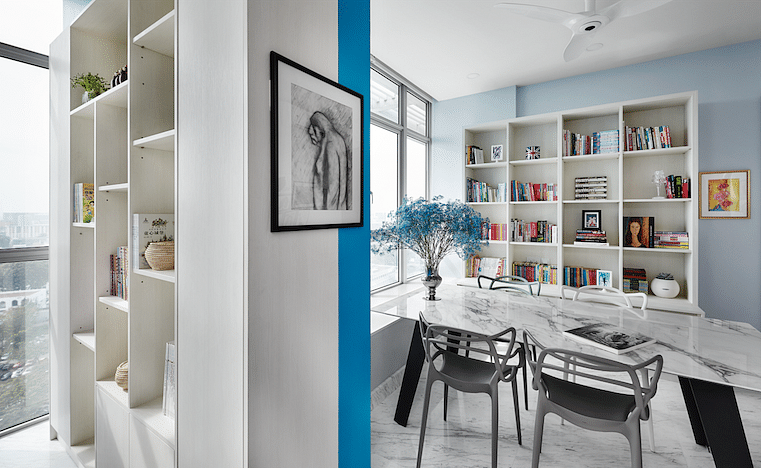 A customised bookshelf doubles as a partition to shield the communal study corner from distractions.