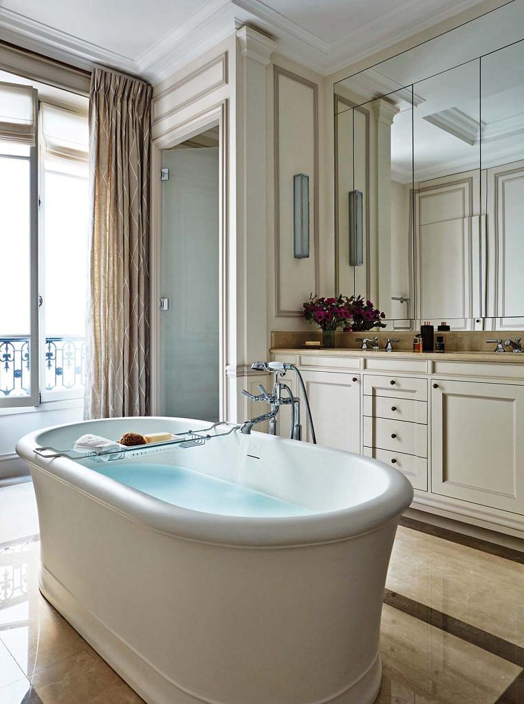 A large freestanding bathtub takes centerstage in the master bathroom.