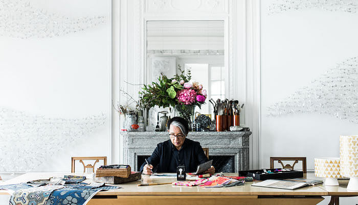 Kenzo Takada at work in his atelier. Image courtesy of Zoe Fidji.