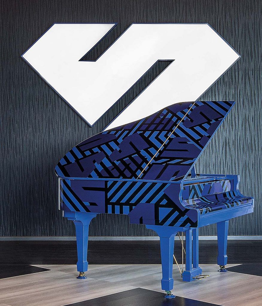 An eye-catching grand piano in a refreshing shade of blue placed in front of the Sapphire Windows Pte Ltd logo.