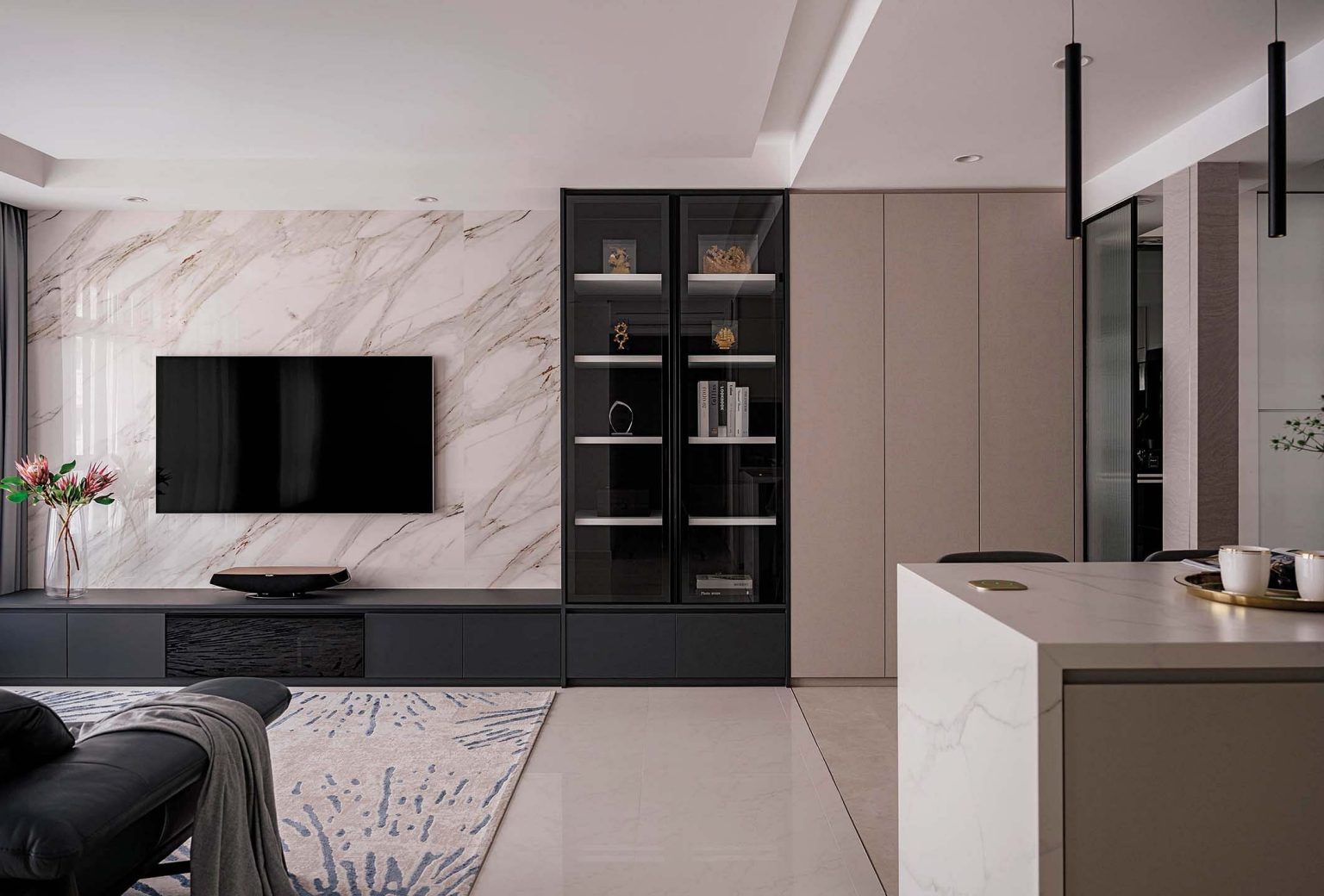 A marble look, laminated porcelain tile in large format was selected for the living room feature wall.