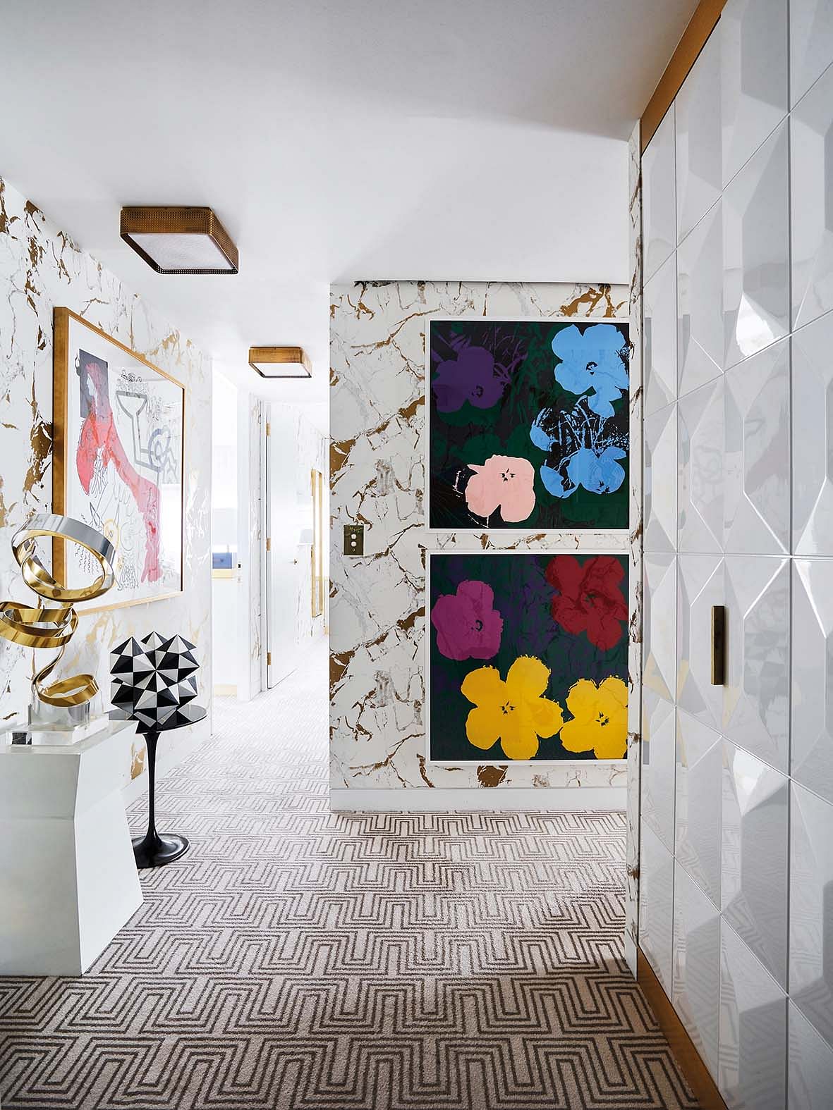 Contemporary artworks line the walls of the home.
