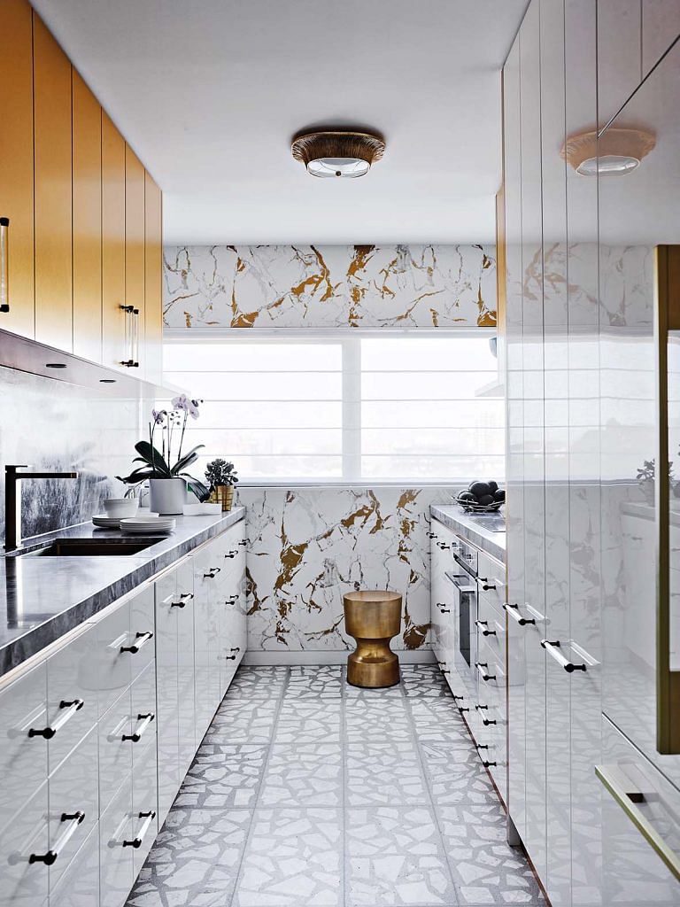 The terrazzo marble floor adds a sense of dynamism to the formal look of the kitchen.
