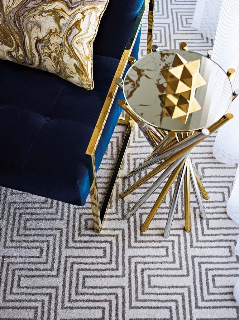 Metallic accents help to offset the rich colours and the patterns in the room.