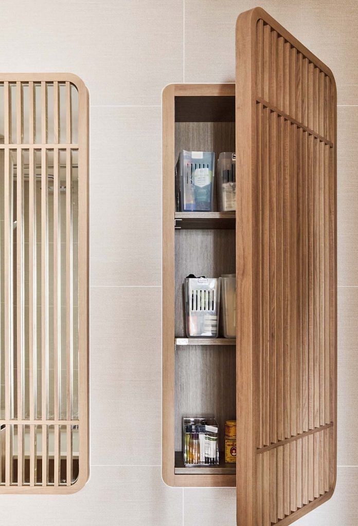The decorative screens actually open up to reveal storage areas in the bathroom.