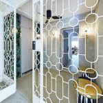 The recess area was transformed into a foyer encased in geometric grill.