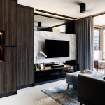 The TV feature wall comprises marble finish that add a touch of luxe, and a strip of mirrored panel above it that makes the space feel more spacious.