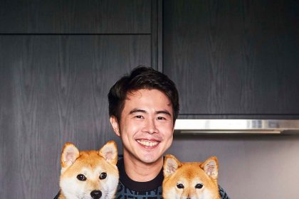 The 36-year-old entrepreneur, Clive Choo, in his 2-bedroom condominium in Siglap, pictured with his two dogs, Miwa and Yoshi