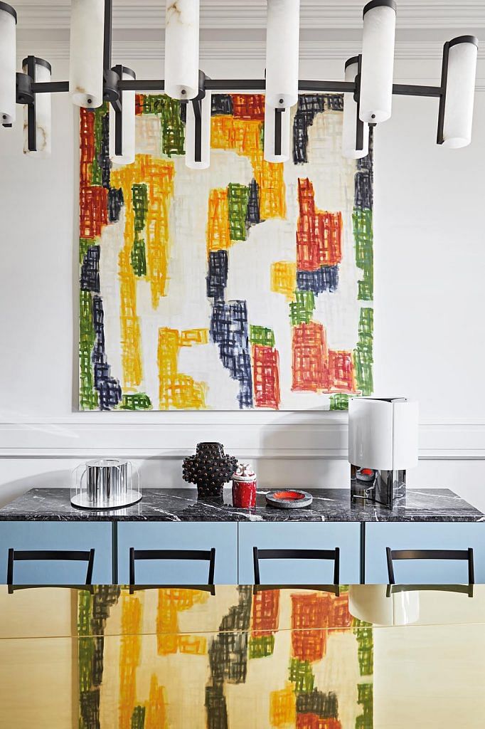 Art pieces inject a pop of colour into the spaces.