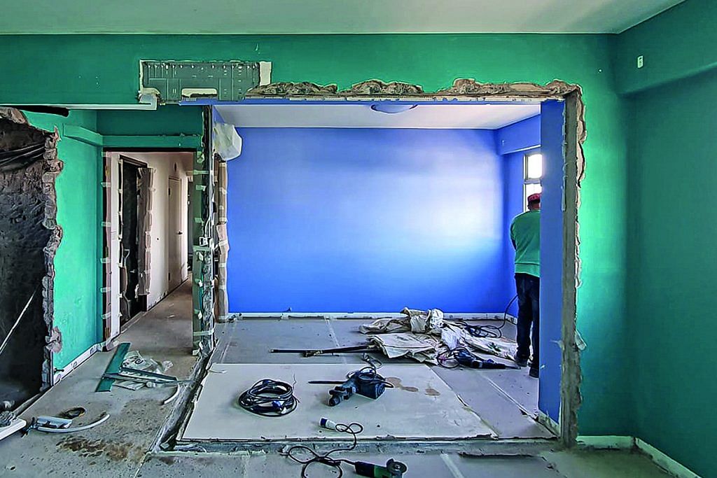 The bedroom before renovation, as hacking works were ongoing.