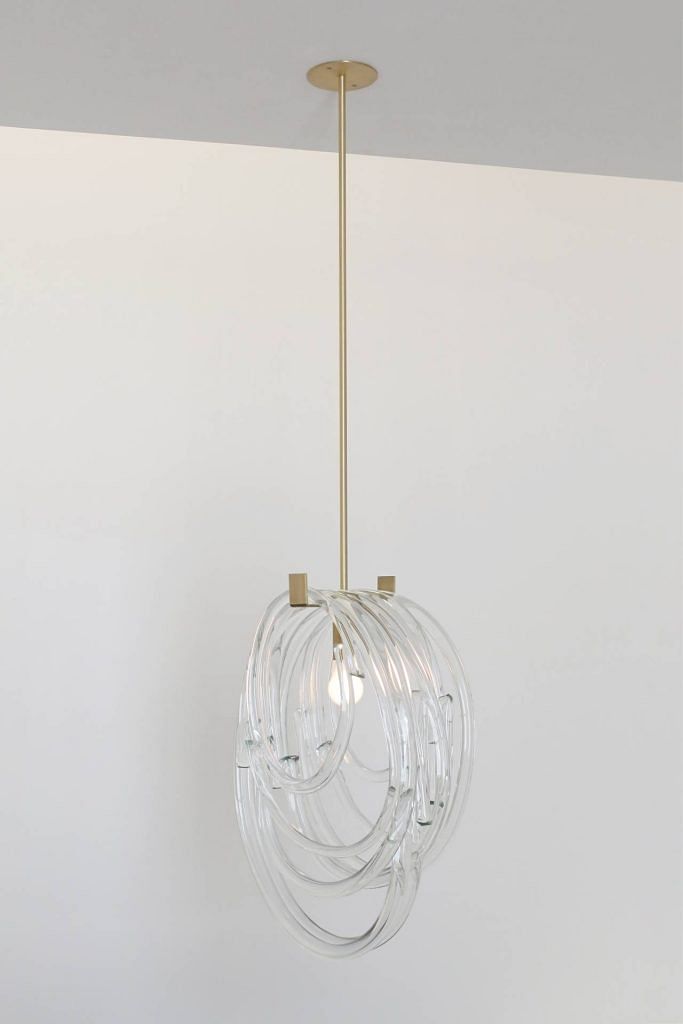 SkLO Lasso pendant lamp in clear glass, brushed brass, and gold cord is priced at $7,299 from Sol Luminaire Singapore