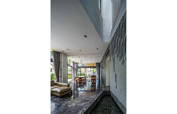 The marble floors coupled with the high ceilings keep this semi-detached house in Trevose Place, Bukit TImah, cool in Singapore's tropical weather.