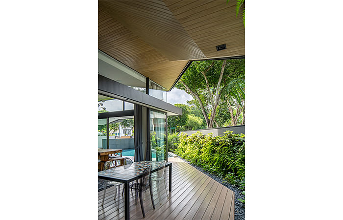 The architects managed to fit in a sheltered outdoor patio suitable for alfresco dining room in this semi-detached house at Trevose Place, Bukit Timah.