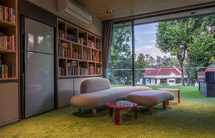 An artificial grass carpet covers the reading room floors to enhance the garden effect in this semi-detached house at Trevose Place, Bukit Timah.