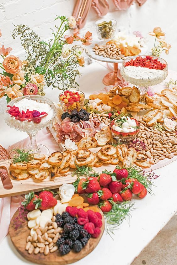 Use different shapes, types, and materials of plates and dishes to style your charcuterie and cheese grazing table.