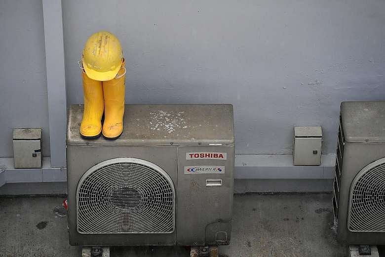 A worker's gear in the courtyard where children once played.
