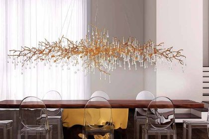 A Bijout chandelier hanging above a dining table.