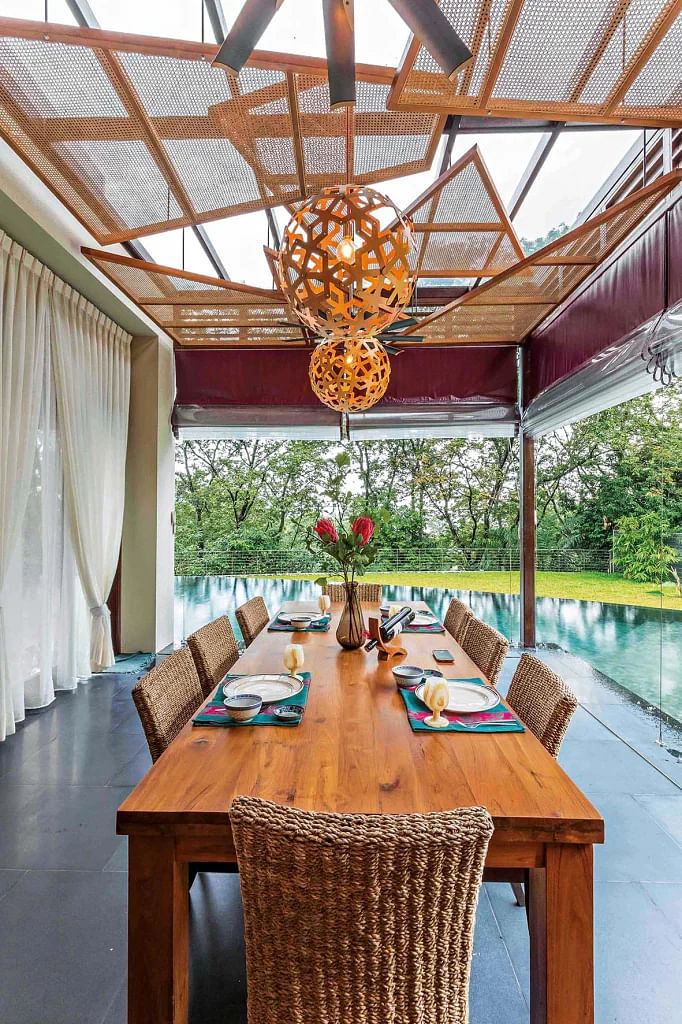 The open dining area next to the pool is one of the homeowner’s favourite spots for taking in the views surrounding the house.