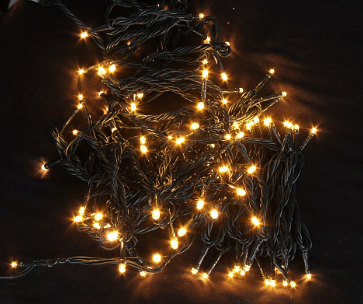 Christmas tree with fairy lights in the dark